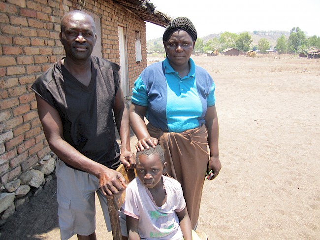 Photograph 1: Fisherman (46) with his wife and their last-born child
