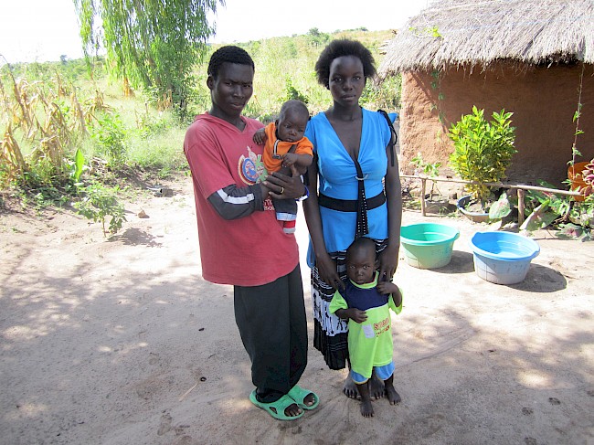 Photograph 3: Bricklayer (22) with his wife and their two children