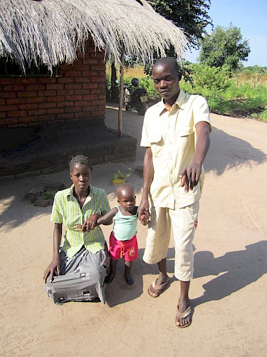 Photograph 4: Farmer and part-time NGO worker (26) with his wife and their first child