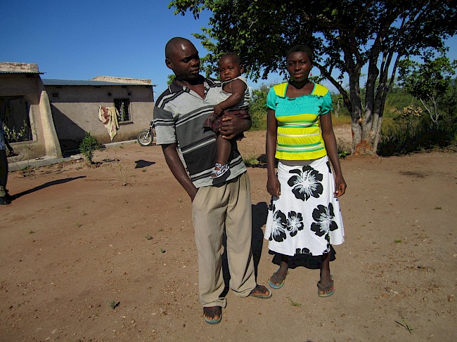 Photograph 5: Farmer (28) with his wife and their first child