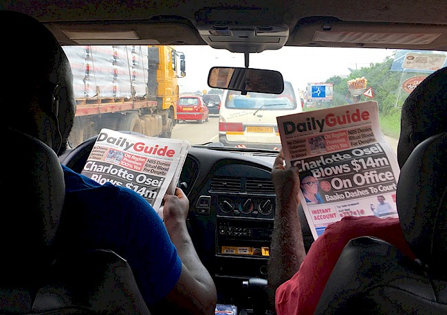 4. Reading the paper, Kumasi. Ashanti Region, Ghana, 2018.