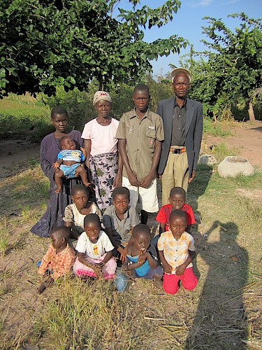 Photograph 6: Farmer (52) with his wife and three generations of their family