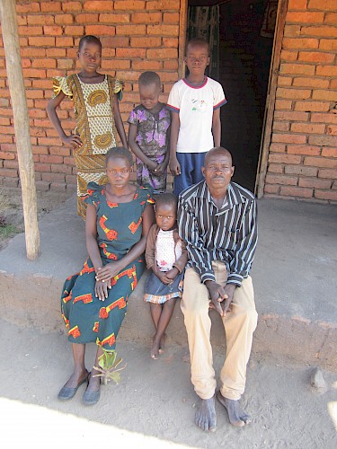 Photograph 7: Farmer (44) with his first wife and their children